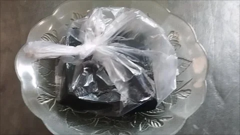 PLASTIC PACKAGING RING CABBAGE IS ON THE PLATE Stock Footage 297027073