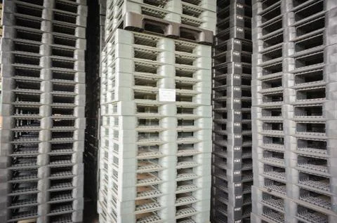 Plastic pallets in warehouse. Stock Photos