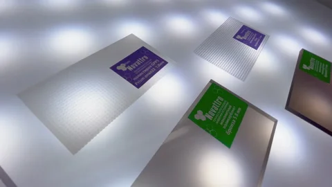 Plastic panels with nameplates on white surface with shade Stock Footage 234899056