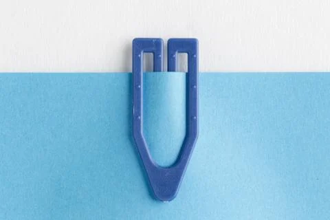 Plastic paper clip on blue note Stock Photos