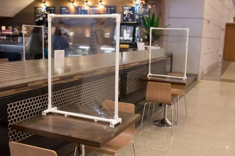 Plastic partition on table in resturant Stock Photos