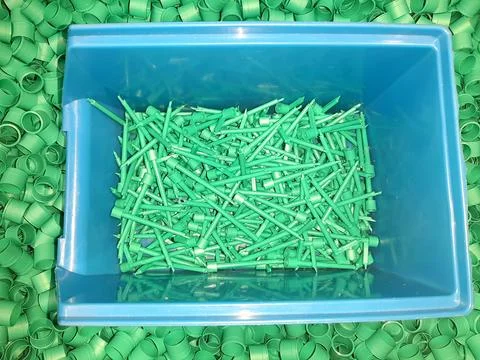 Plastic-parts-in-box-container-033 Stock Photos