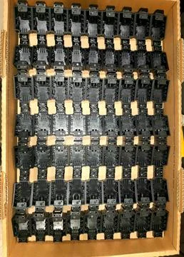 Plastic-parts-in-box-container-034 Stock Photos
