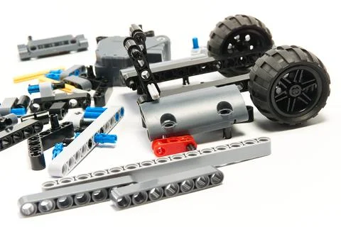 Plastic parts of the constructor, connecting elements and wheels for assemb.. Stock Photos