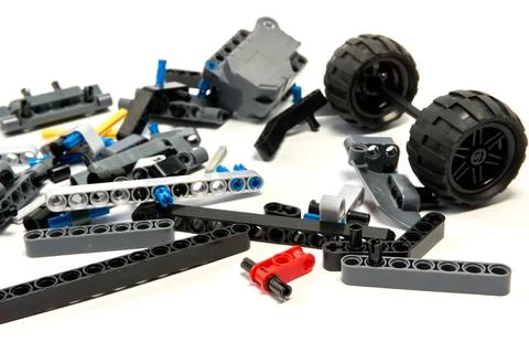 Plastic parts of the constructor, connecting elements and wheels for assemb.. Stock Photos