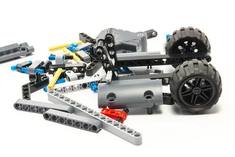 Plastic parts of the constructor, connecting elements and wheels for assemb.. Stock Photos