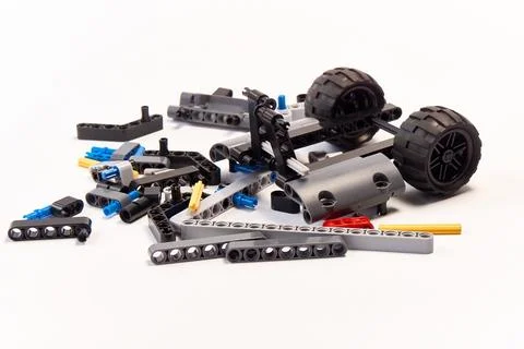 Plastic parts of the constructor, connecting elements and wheels for assemb.. Stock Photos