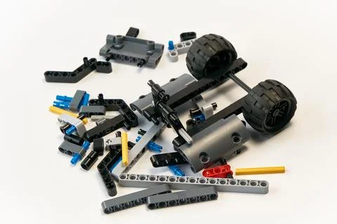 Plastic parts of the constructor, connecting elements and wheels for assemb.. Stock Photos