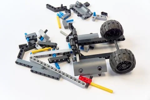 Plastic parts of the constructor, connecting elements and wheels for assemb.. Stock Photos