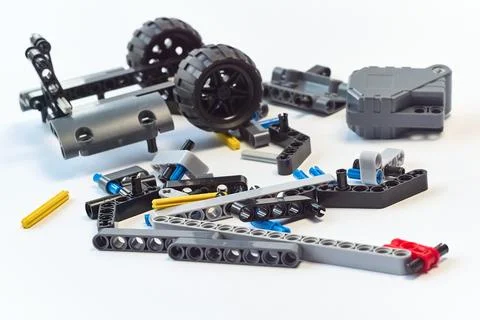 Plastic parts of the constructor, connecting elements and wheels for assemb.. Stock Photos