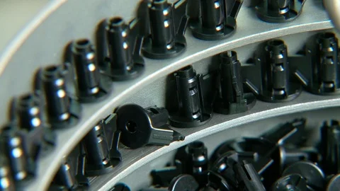 Plastic parts on a conveyor in an assembly machine Video stock 115286997