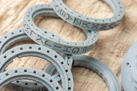 Plastic parts printed on a 3D printer, round letters rings for cryptex printed Stock Photos