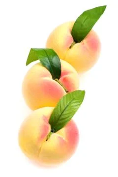 Plastic peach on white Foto stock
