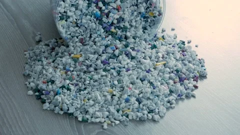 Plastic pellets spilling on background. Stock Footage 233385424