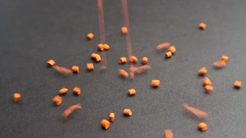   Plastic pellets spilling .Polymeric dye colorant for plastics. Plastic resin Stock Footage 88967262