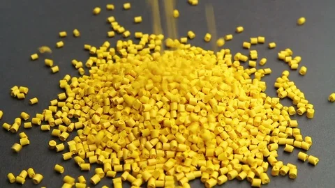 Plastic pellets spilling .Polymeric dye colorant for plastics. Plastic resin Stock Footage 88967293