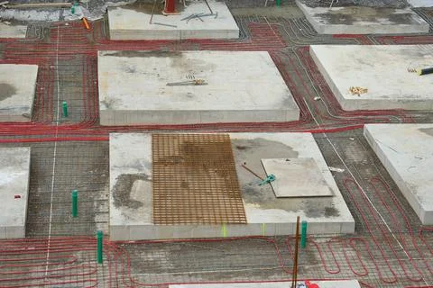 Plastic Pipe Installation for Underfloor Heating in New Building Project. Stock Photos