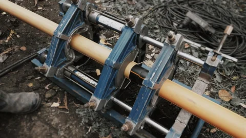 Plastic pipe welding equipment in operation. Stock Footage 318268066