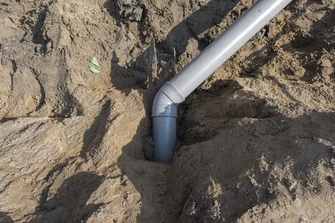 Plastic pipes in the ground during the construction of a building 스톡 사진