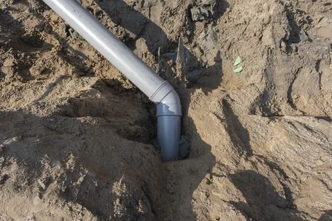 Plastic pipes in the ground during the construction of a building Stock Photos