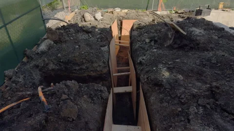 Plastic pipes laid in trenches. Top down wide shot of trenches Stock-Footage 313015409