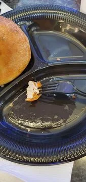 On a plastic plate bread chicken meat on a fork (1) Stock Photos