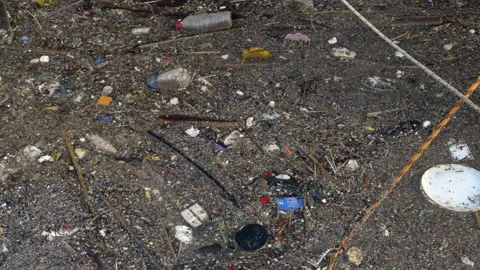 Plastic Pollution and Floating Waste on Sea Surface Stock Footage 327822991