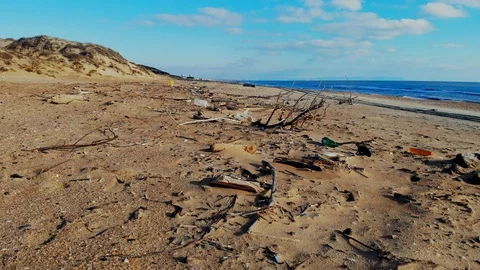 Plastic pollution on beach and in ocean. Aerial view of garbage on the coast Stock Footage 105582687