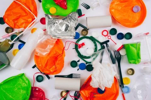 Plastic pollution concept. Be plastic free. Broken single-use colorful plates Stock Photos