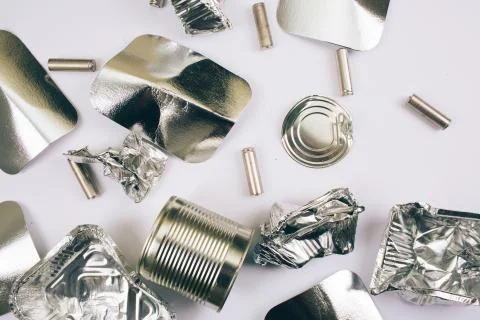 Plastic pollution concept. Foil containers, silver cardboards, metal cans and Stock-Fotos