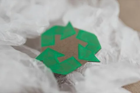 Plastic pollution concept, group of plastic bags with green recycle symbol Stock Photos