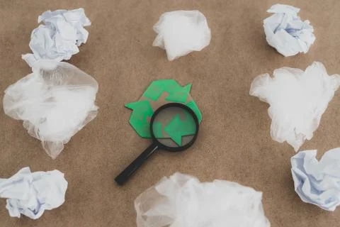 Plastic pollution concept, group of plastic bags with green recycle symbol an Stock Photos