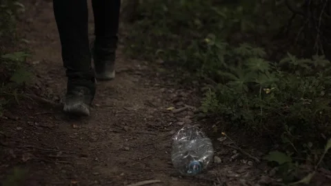 Plastic pollution of the forest. Bad habit of throwing garbage in the forest Stock Footage 280459573