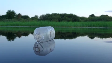 Plastic pollution in lake. Ocean waste pollution, marine debris. Stock-Footage 286134753
