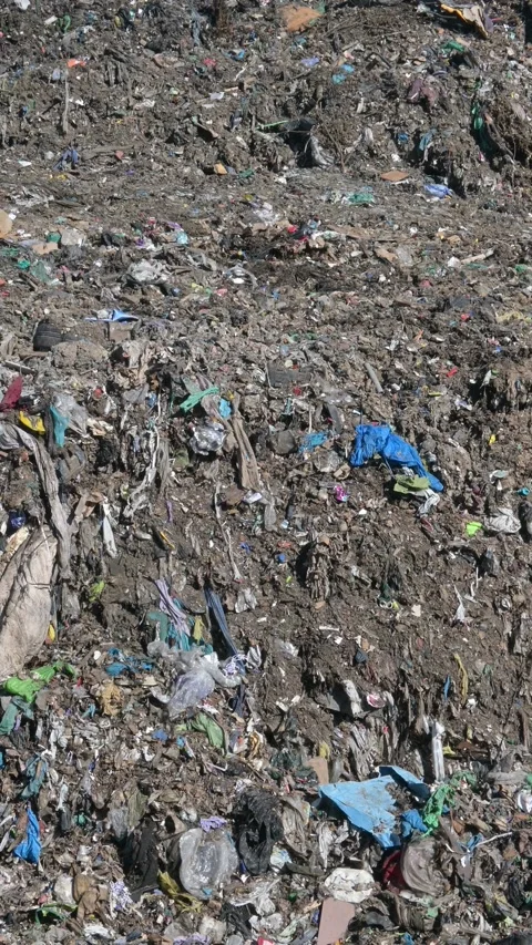 Plastic pollution in landfills and garbage. Vertical video. Video stock 162332762