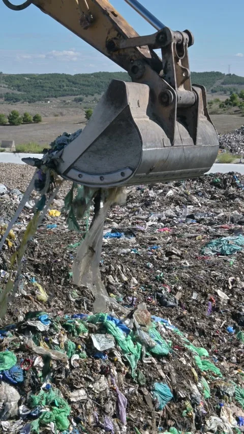 Plastic pollution in landfills and garbage. Vertical video. Stock Footage 162332845
