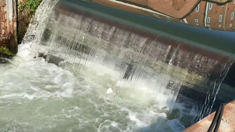 Plastic pollution in a limpid waterfall with many foam in a lock. Stock-Footage 89811717