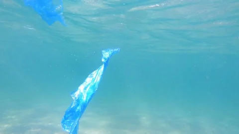 Plastic pollution in ocean environmental problem. Bags dumped in sea Stock Footage 94997742