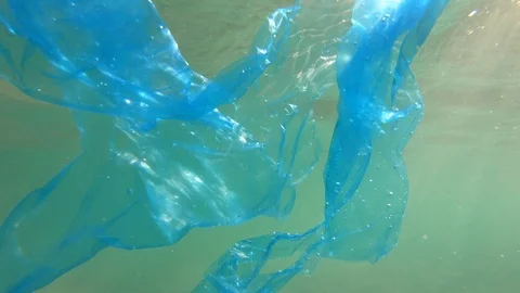 Plastic pollution in ocean environmental problem. Bags dumped in sea Stock Footage 94997810