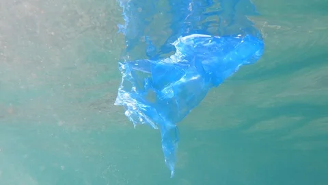 Plastic pollution in ocean environmental problem. Bags dumped in sea Stock Footage 94997920