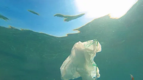 Plastic pollution in ocean environmental problem. Plastic bags, straws and Stock Footage 114020367