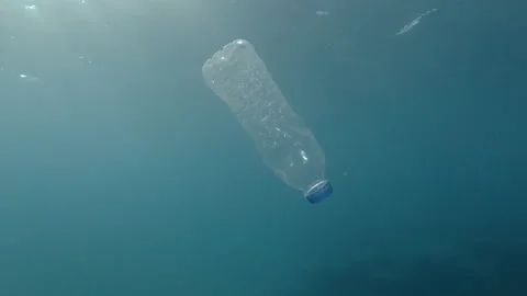 Plastic pollution, plastic bottle underwater. Discarded plastic bottle slowly dr Video stock 167125611