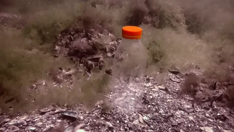 Plastic pollution: PVC bottle slowly sin... | Stock Video | Pond5