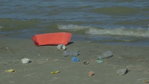 Plastic pollution on the sandy beach. Plastic and other garbage from all Europe Stock Footage 140433984
