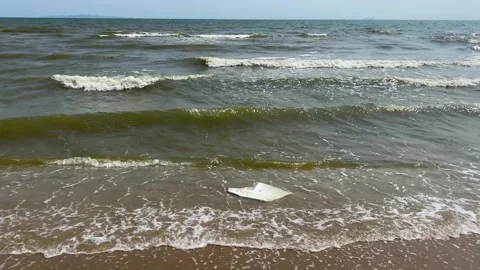 Plastic pollution is seen in Jomtien beach, Pattaya, Thailand 4K Stock Footage 241219342