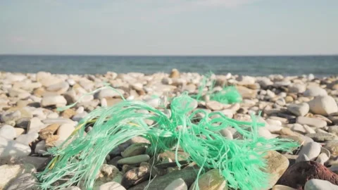 Plastic pollution slowly disappearing from beach Stock Footage 289663373
