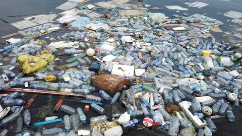 Plastic pollution trash in ocean with different kinds of garbage - plastic Stock Footage 115199269