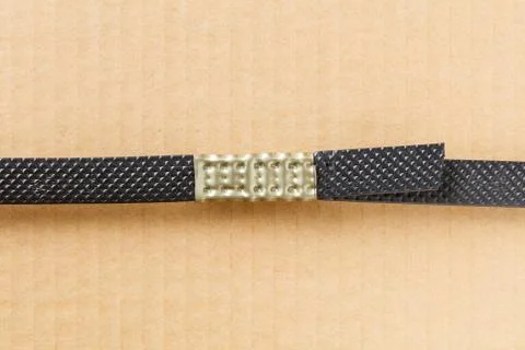 Plastic poly strap with metal clamp Stock Photos