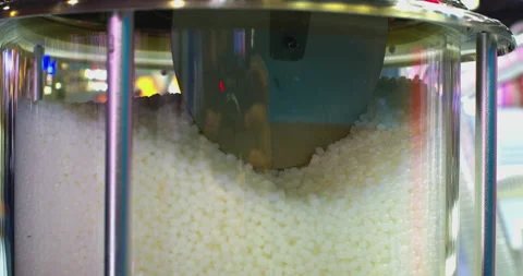 Plastic polymer granules moving inside industrial equipment Stock Footage 328641717