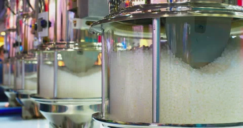 Plastic polymer granules moving inside industrial equipment Stock Footage 329180584